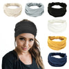 A woman models several non-slip elastic headbands in beige, gray, black, white, yellow, and blue.
