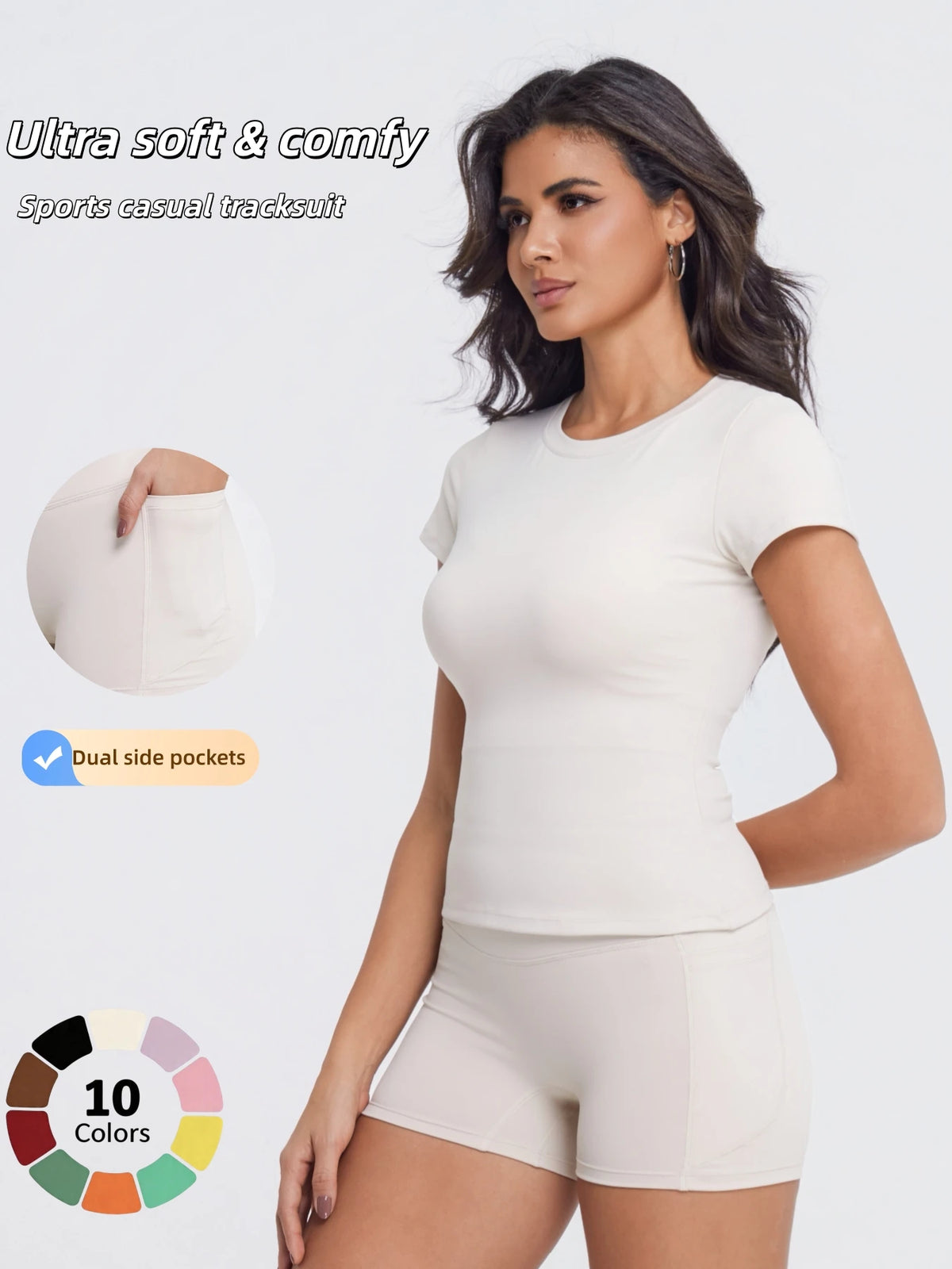 A woman models a light beige sports casual tracksuit top and shorts with dual side pockets.