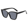 Black cat eye vintage sunglasses with gradient lenses shown against a white background