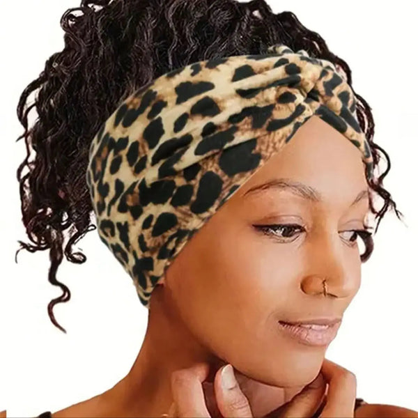 A woman wearing a leopard print extra-wide hair band headscarf