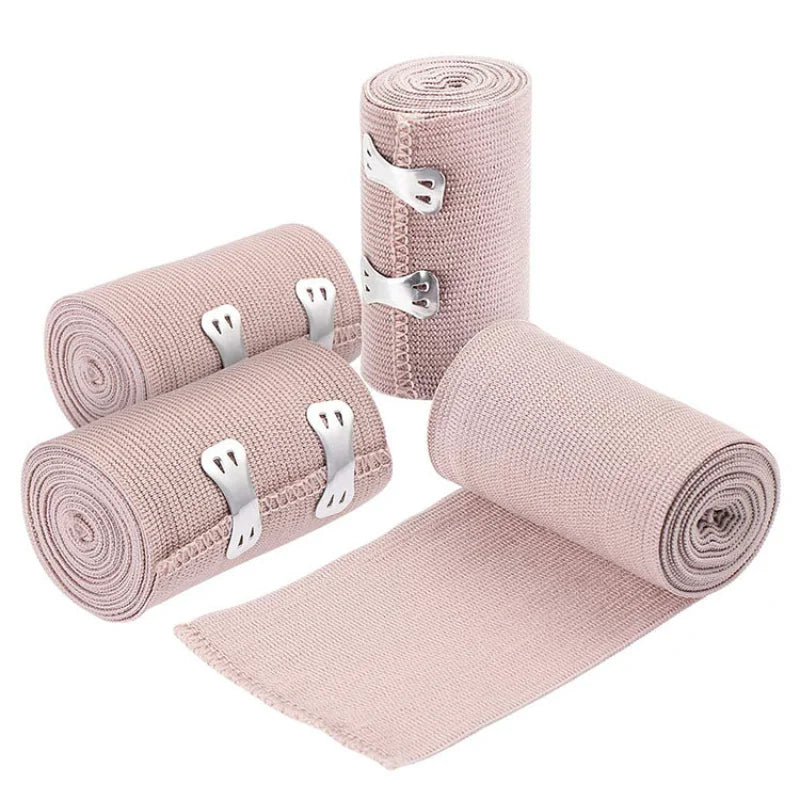 Rolls of pink elastic skin tone tendon bandages with metal clasps