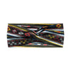 A close-up of a bohemian vintage print headband featuring geometric patterns in black, white, and multicolored stripes.