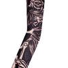 A black and grey tattoo sleeve featuring a skull design on an arm.