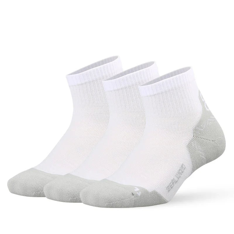 A pair of white and gray breathable performance running socks laid flat.