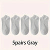 Five pairs of gray comfort fit ankle socks laid out in a row.