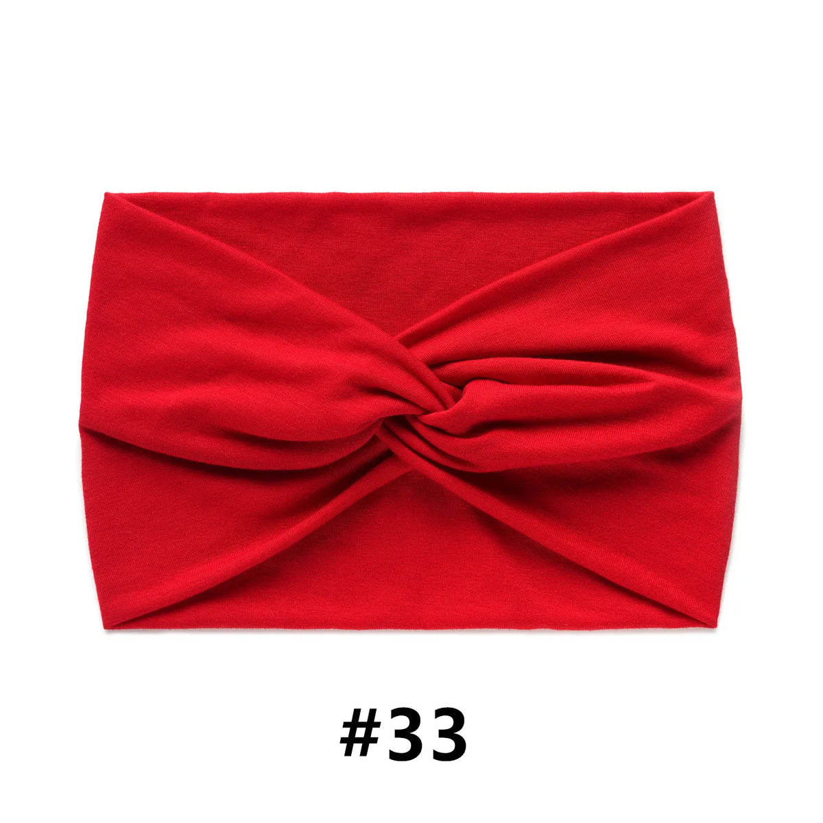 A folded red fabric item, likely a boho wide turban headband, shown flat.