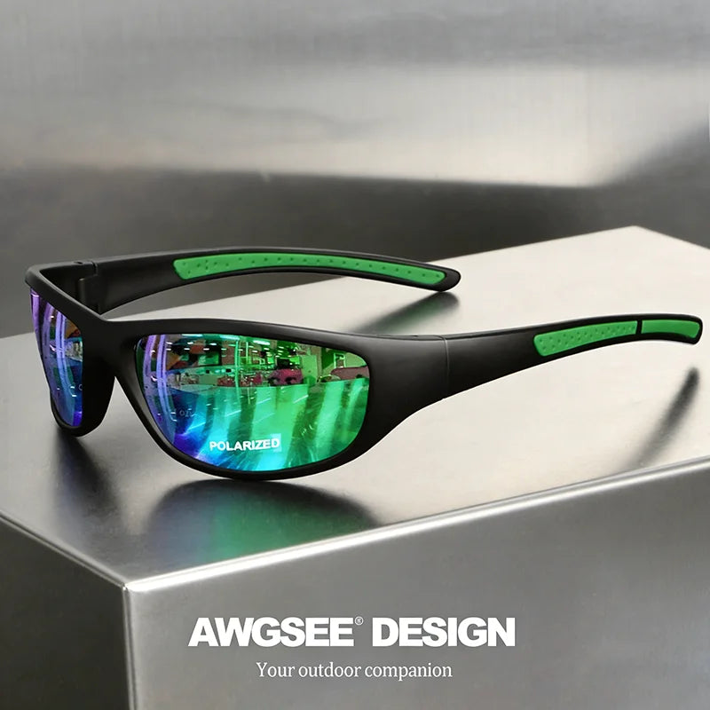 Black polarized sports sunglasses with green accents resting on a gray surface.