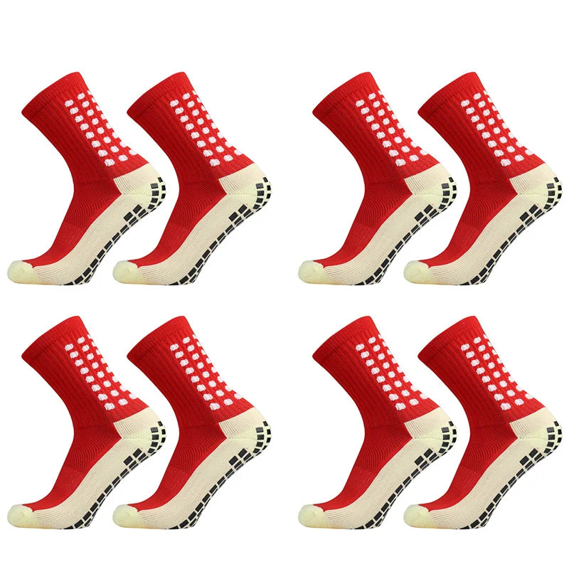 Ein Set rote und weiße rutschfeste Sportsocken aus Vogelperspektive.