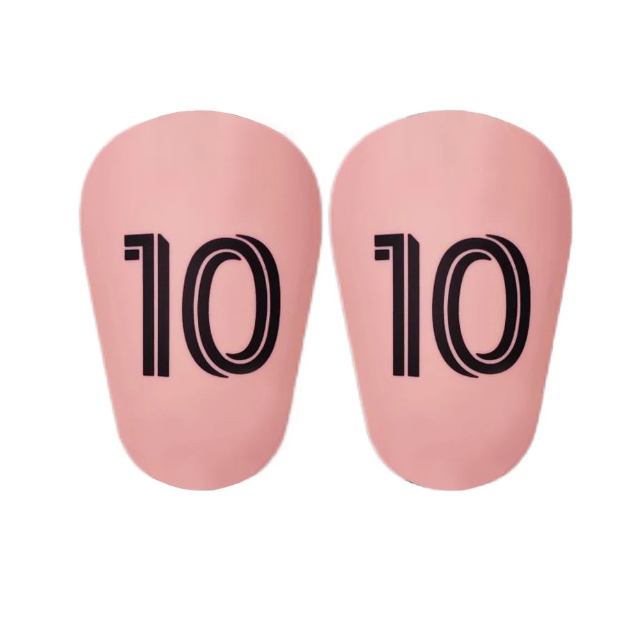 A pair of pink mini football shin guards for youth and adult players.