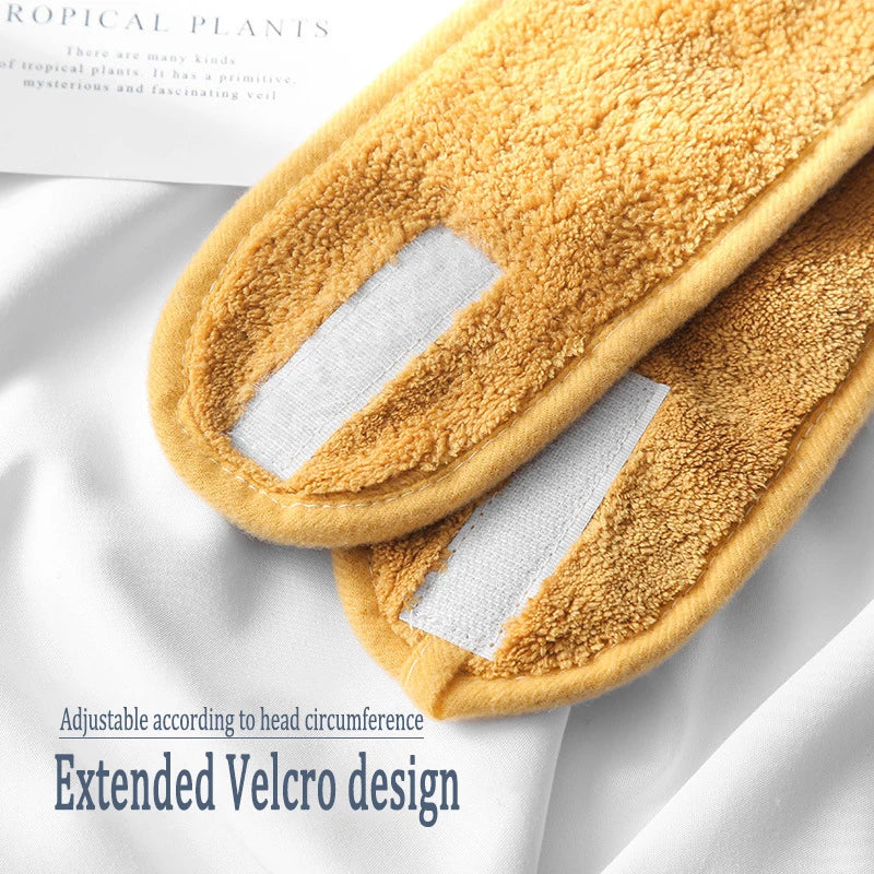 A pair of yellow faux fur hair accessories with an extended velcro design shown on a white background.