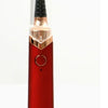 A close-up view of a red automatic electric eyebrow trimmer with a black grooming tip.