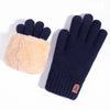A pair of navy blue knit gloves with a light tan faux fur palm and touchscreen technology.