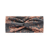 A gray fabric headband featuring a vintage floral print in shades of terracotta and muted pink.