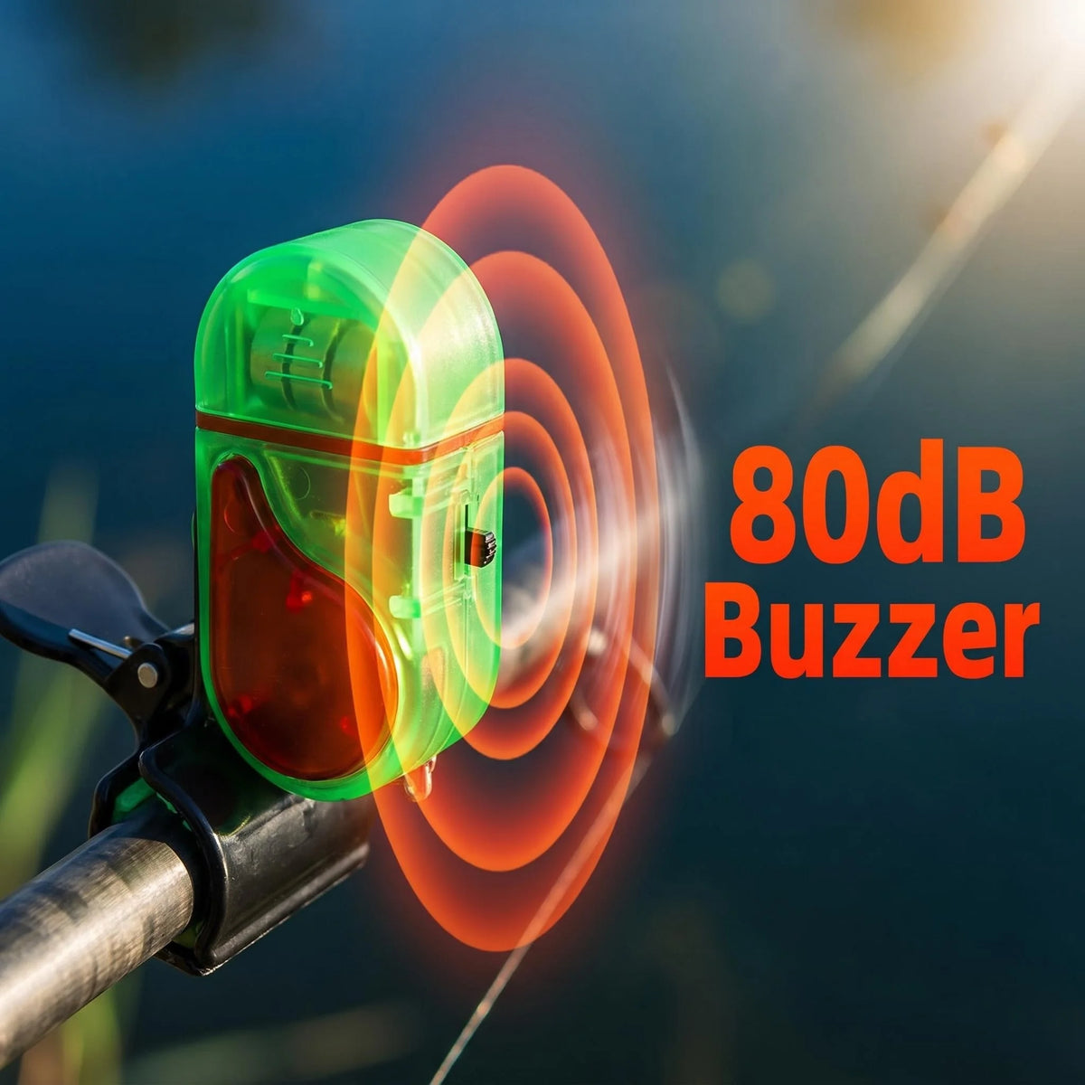 A green clip-on fishing bite alarm device with an orange sound wave emanating from it.