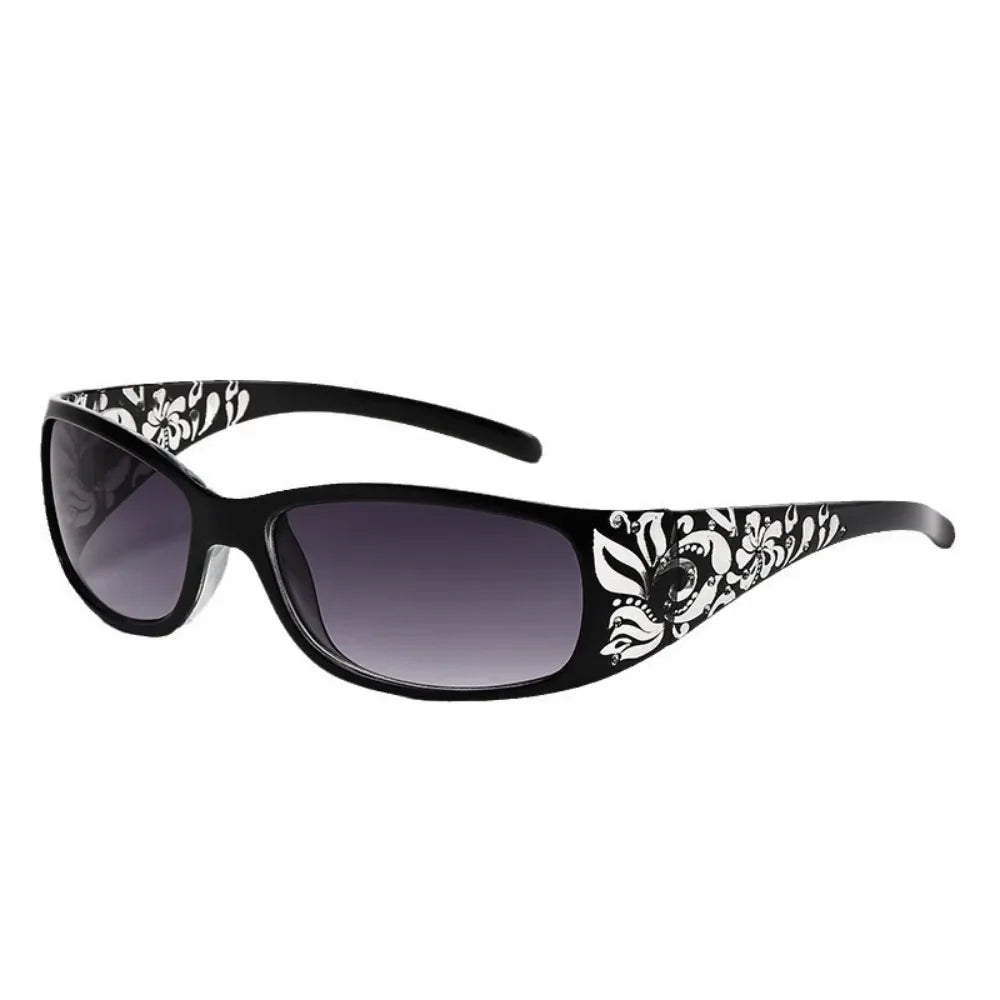 Black sunglasses with a floral pattern and cat eye shape