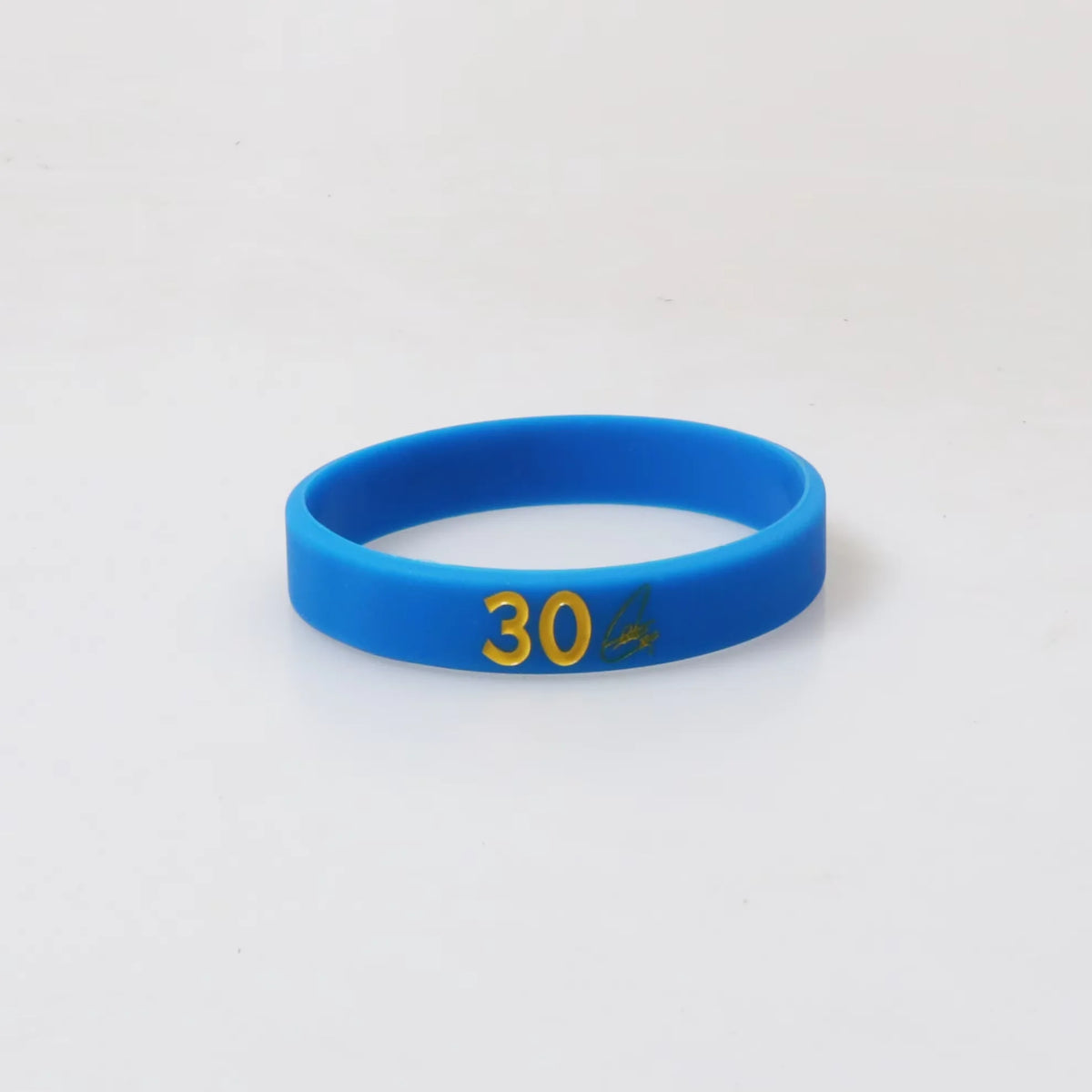 A bright blue silicone wristband with the number 30 printed on it.