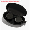 Black velvet box containing a pair of round sunglasses with adjustable dimming.