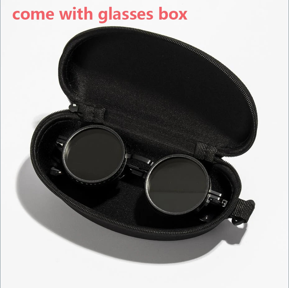 Black velvet box containing a pair of round sunglasses with adjustable dimming.