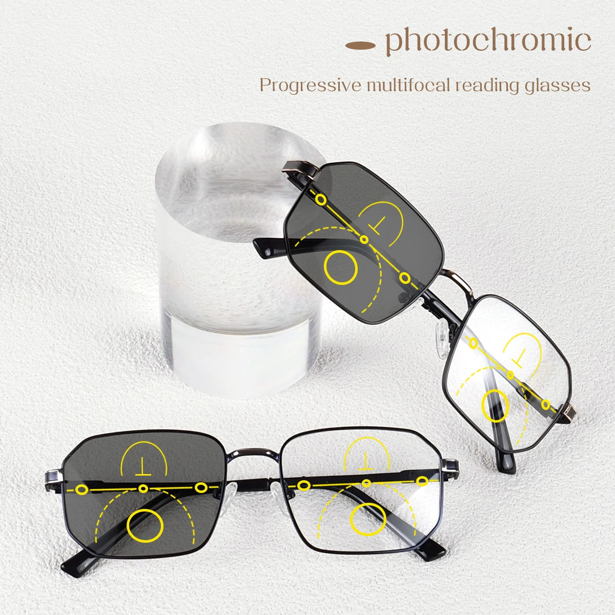 Pair of photochromic progressive reading glasses shown next to a glass, demonstrating multi-focal lens progression.