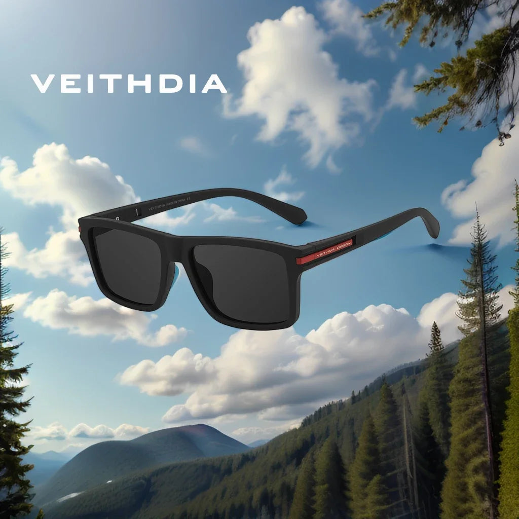 A pair of black square polarized sunglasses is shown against a scenic mountain landscape.
