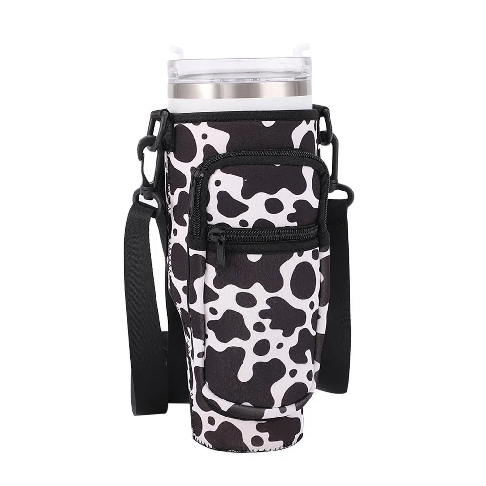 Black and white cow print adjustable pouch for carrying a water bottle