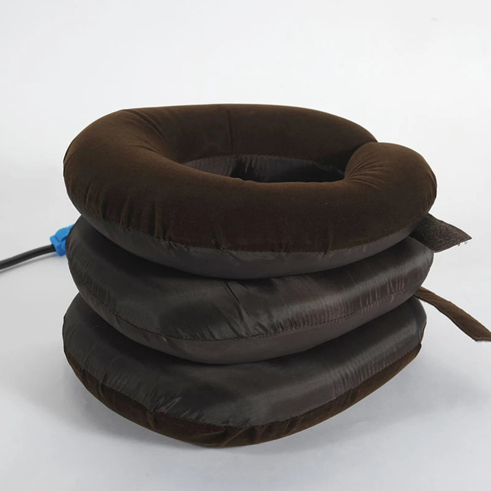 A stack of dark brown inflatable cervical traction stretchers or neck pillows.