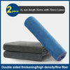 Two blue microfiber cleaning towels rolled and stacked next to an XL size label.