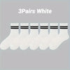 Three pairs of white striped men's socks displayed in a row.