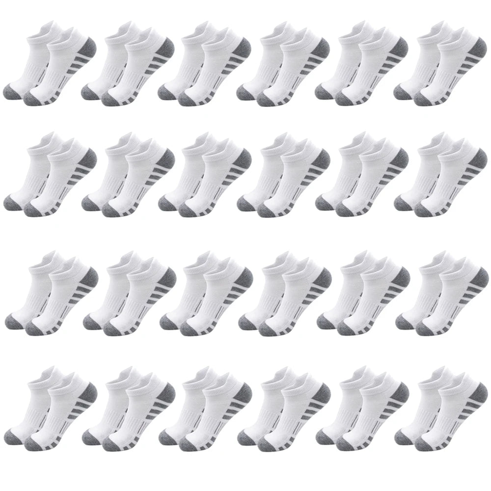A collection of white athletic running socks for men and women displayed in various styles.