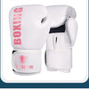 A pair of white PU leather boxing gloves with pink lettering and a logo on the wrist strap.
