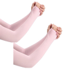 A pair of light pink ice silk arm sleeves being held together.