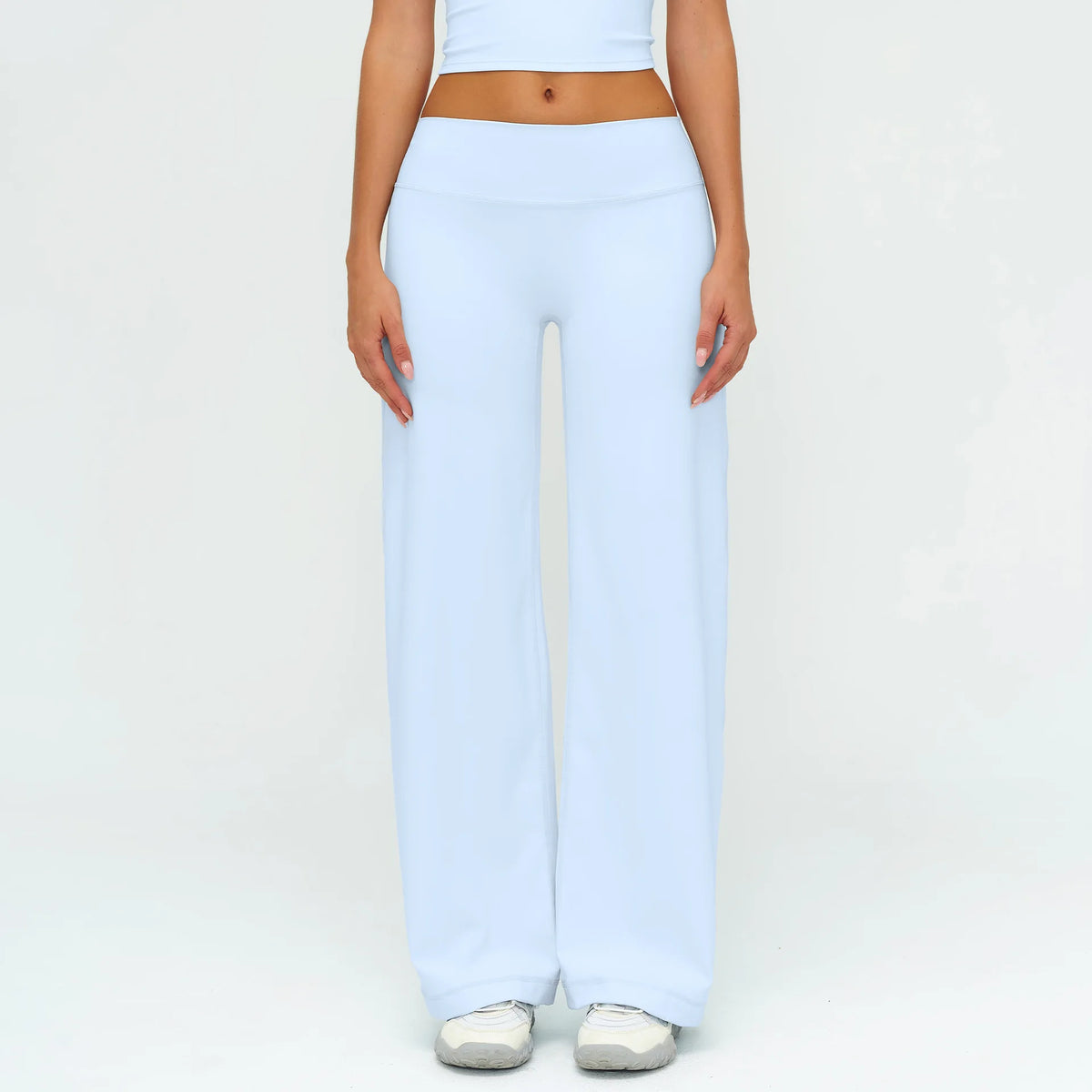 Light blue high-waist wide-leg yoga leggings worn by a person.