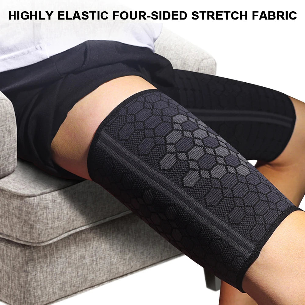 Black four-sided stretch fabric compression thigh sleeves worn on a person's leg.
