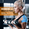 A blonde woman exercising with dumbbells, demonstrating relief from muscle pain.