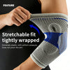 A hand is demonstrating a stretchable fit tightly wrapped silicone elbow guard sleeve on an arm.