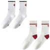A pair of white crew socks with red trim and ribbed texture.