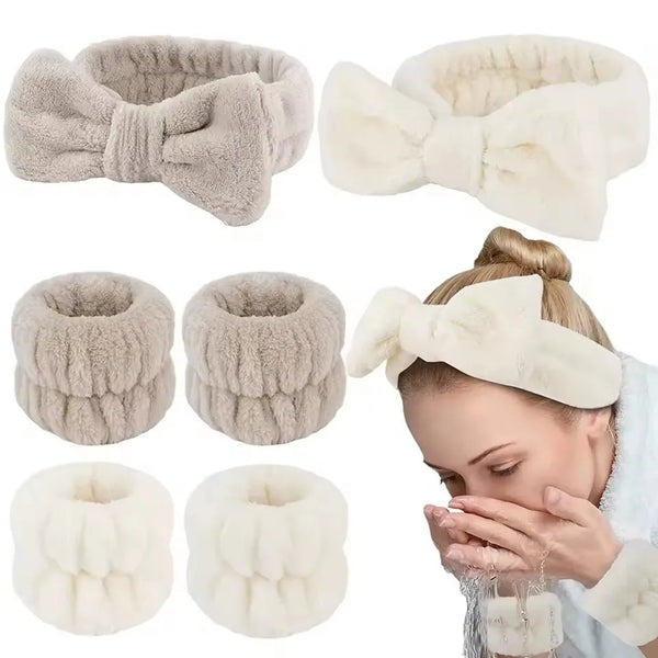 A set of soft, fluffy white and beige microfiber spa headbands and wristbands shown on a person's hand.