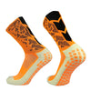 A pair of bright orange and white anti-slip training socks for sports, shown from the side.