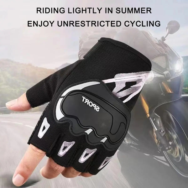 A hand is holding a black and white cycling glove with a clear design against a blurred background of a motorcycle.