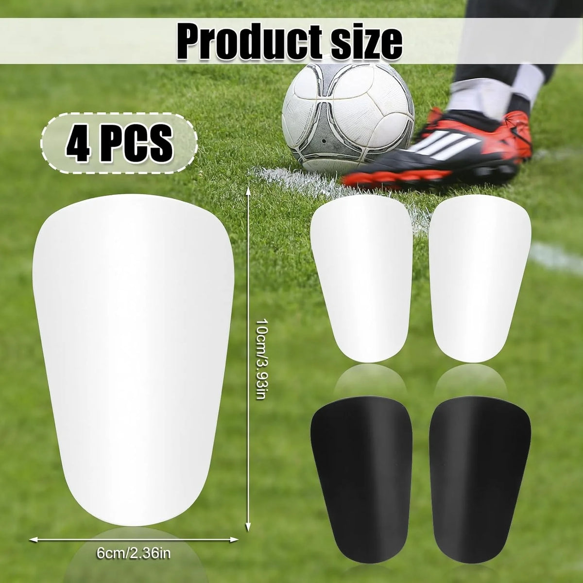 Four white mini soccer shin guards shown next to a soccer ball and athletic shoes on a green field.