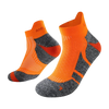 A pair of bright orange performance sports ankle socks with gray accents, shown from the side.