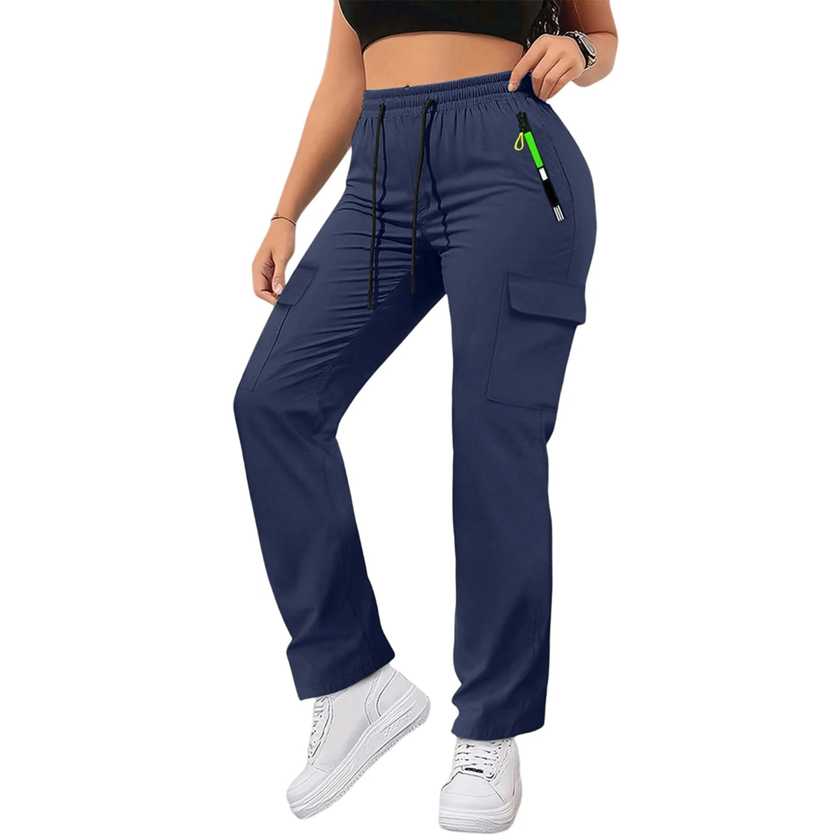 A woman wearing navy blue straight fit drawstring cargo pants with a black top and white sneakers.