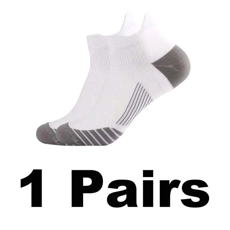 A pair of white performance compression sports socks shown from the side.