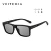Black square polarized sunglasses shown against a white background with icons indicating light conditions.
