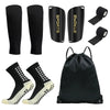 A set of black football training socks and shin guards displayed alongside a black training bag.