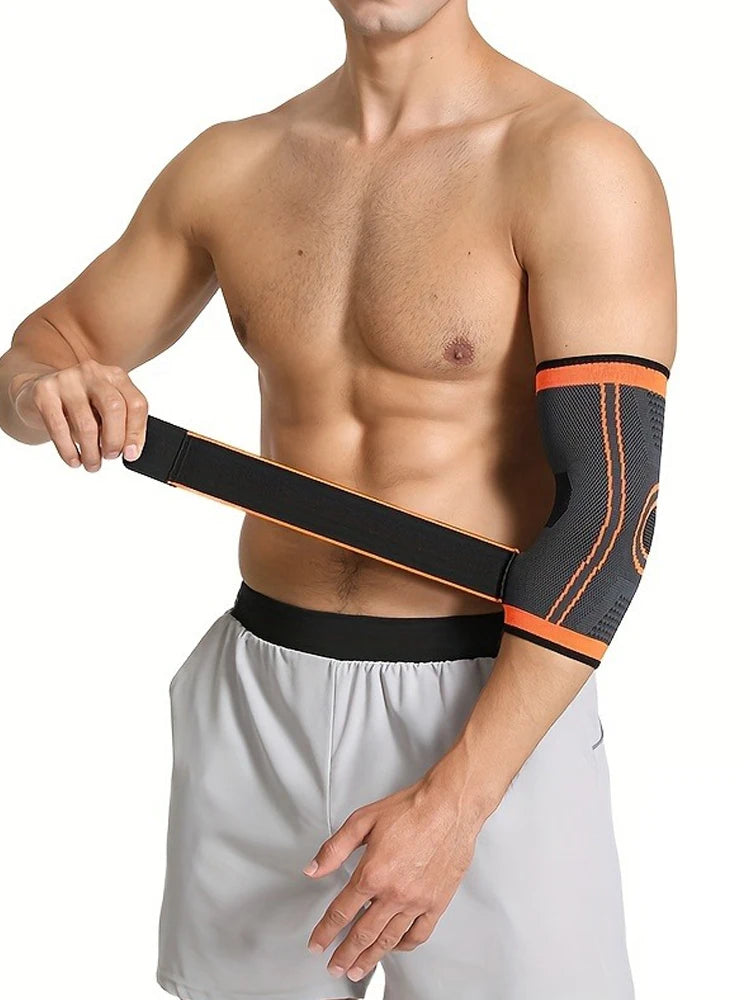 A man wearing a black and orange joint support elbow protector sleeve on his forearm.