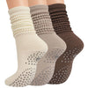 A set of three mid-calf yoga and pilates socks in beige, gray, and brown colors.