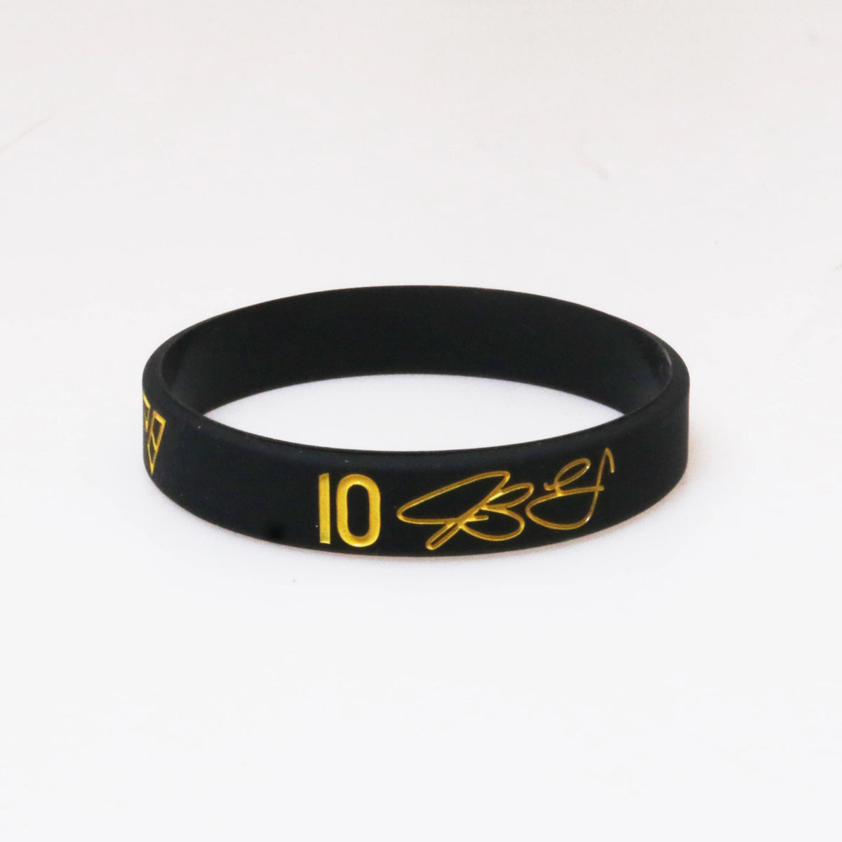 Black silicone wristband with gold embossed number 10 and initials on a white background.