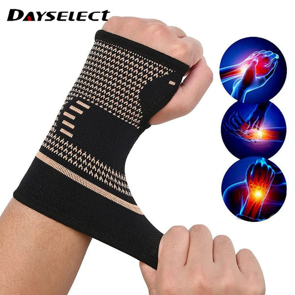 A hand wearing a black copper fiber wrist bracer for fitness and sport.