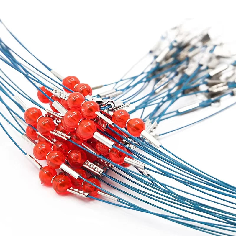 A collection of multi-piece saltwater fishing tackle rigs with red and silver components.